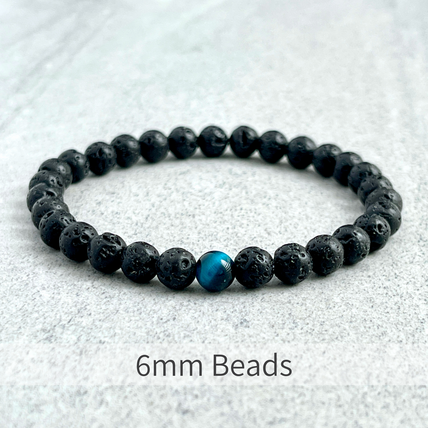 Black Lava and Single Aqua Blue Tiger Eye Stretch Bracelet