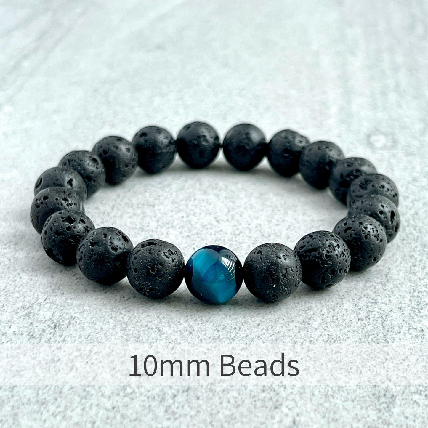 Black Lava and Single Aqua Blue Tiger Eye Stretch Bracelet