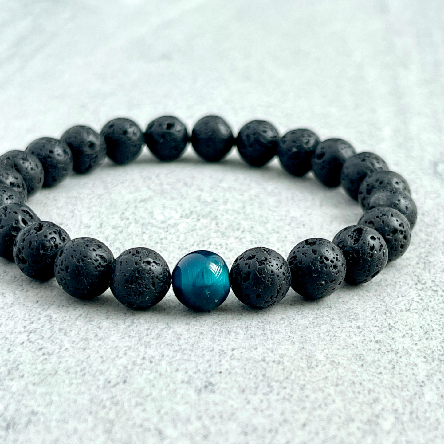 Black Lava and Single Aqua Blue Tiger Eye Stretch Bracelet