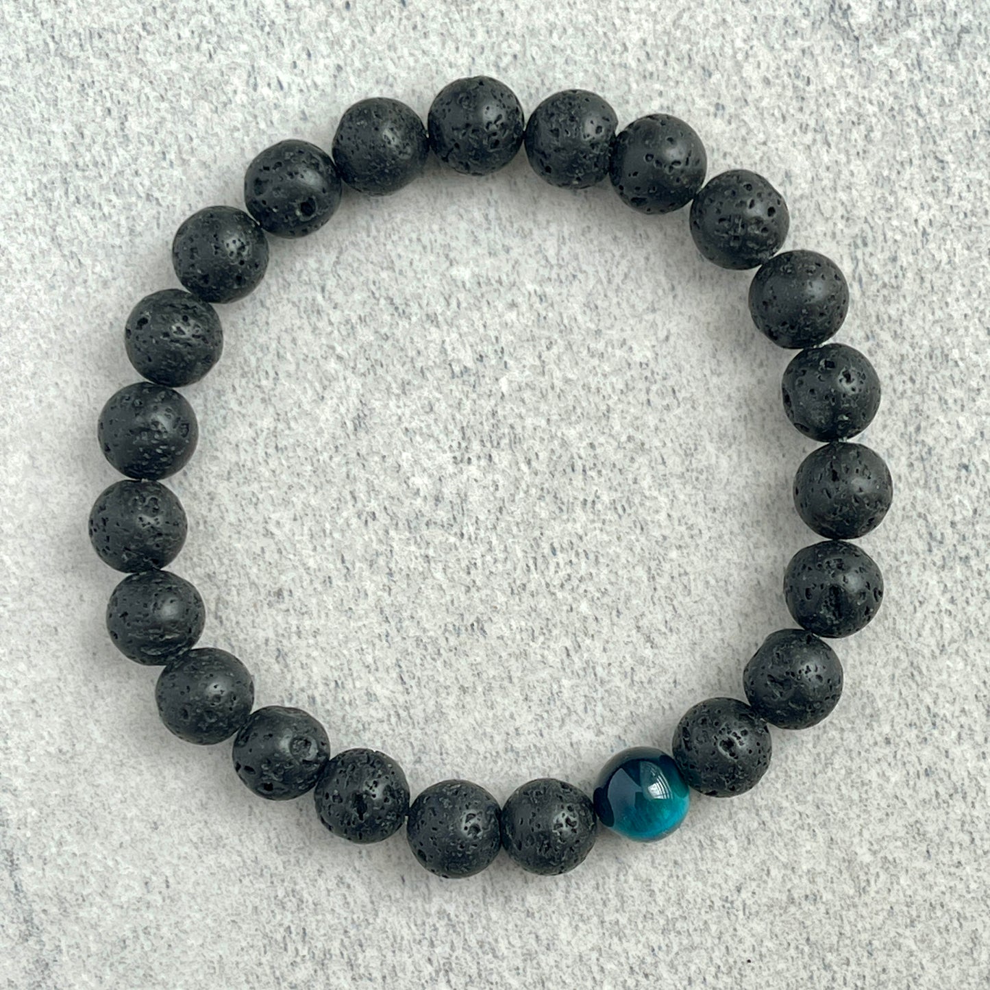 Black Lava and Single Aqua Blue Tiger Eye Stretch Bracelet