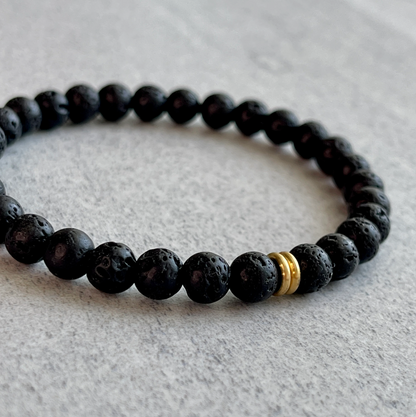 Black Lava Bracelet with Brass Accent Bead