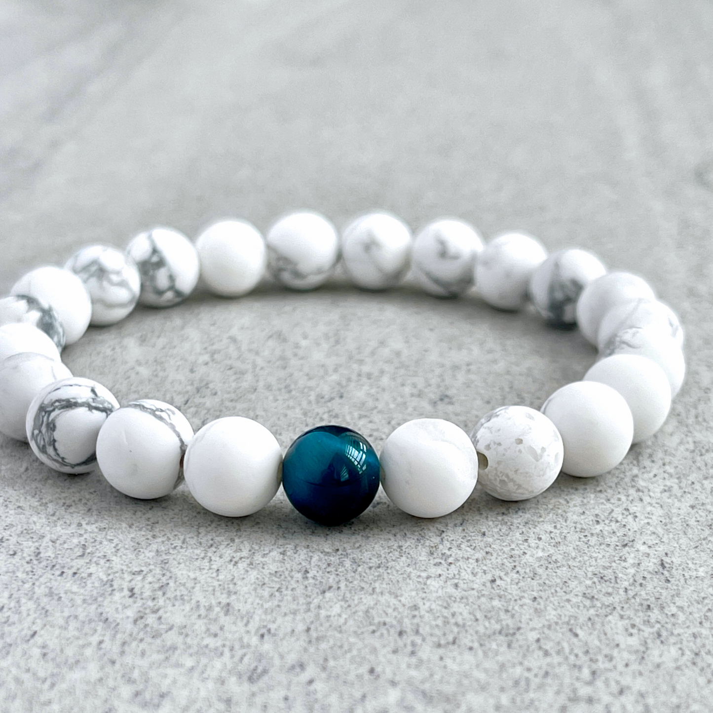 Matte White Howlite with a Single Aqua Blue Tiger Eye Stretch Bracelet