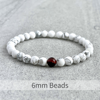 Matte White Howlite with a Single Red Tiger Eye Bracelet