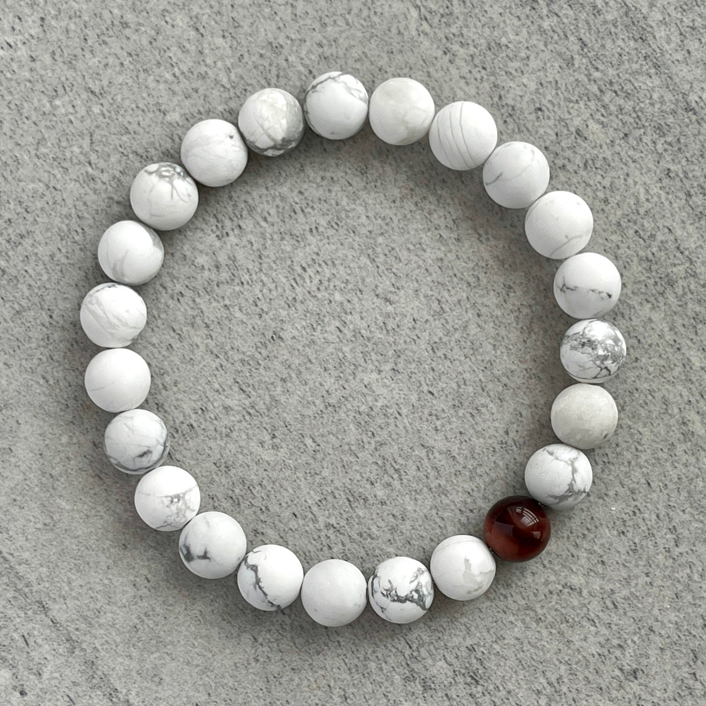 Matte White Howlite with a Single Red Tiger Eye Bracelet