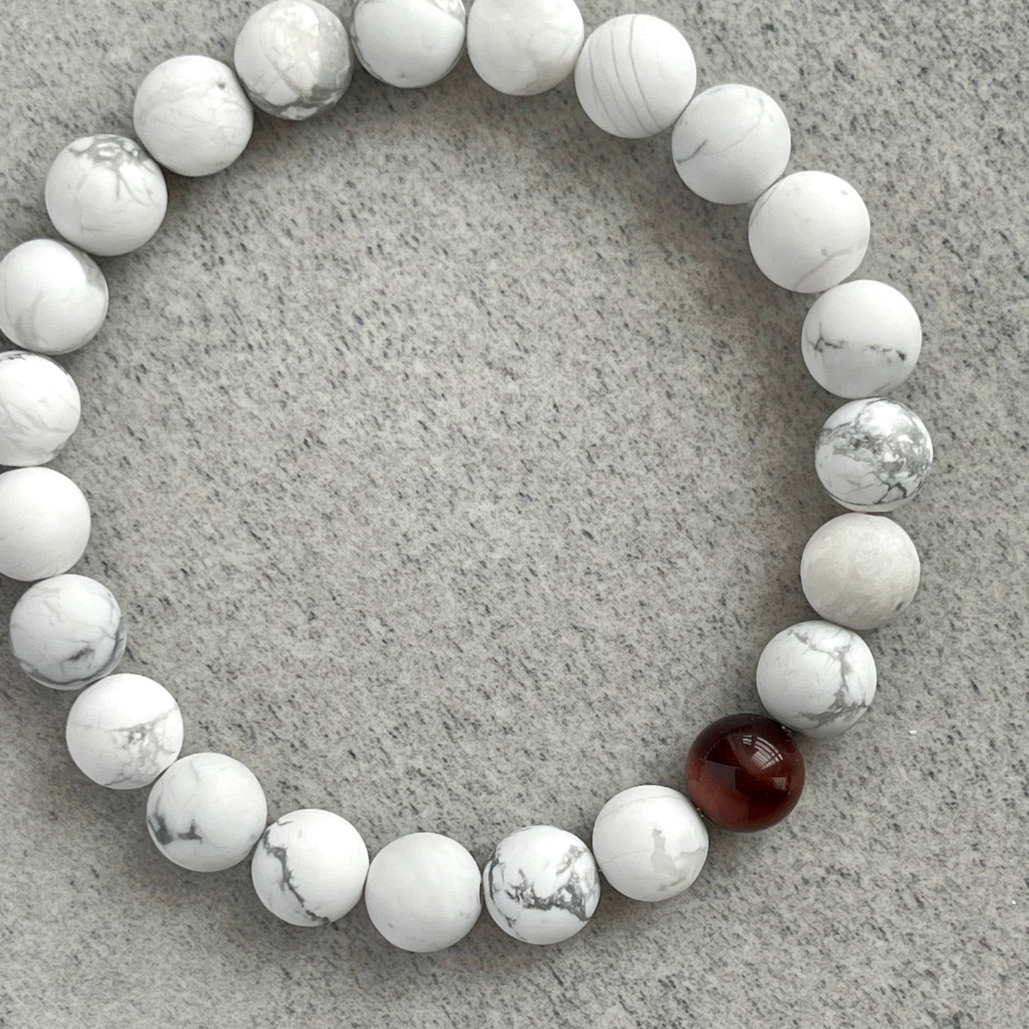 Matte White Howlite with a Single Red Tiger Eye Bracelet