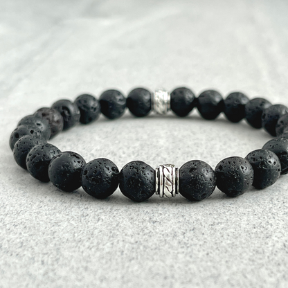 Black Lava Beaded Stretch Bracelet with Celtic Accent Bead